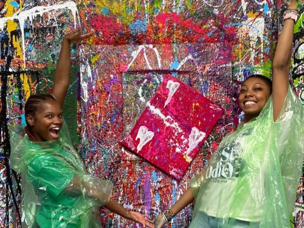 a little girl standing in front of a store