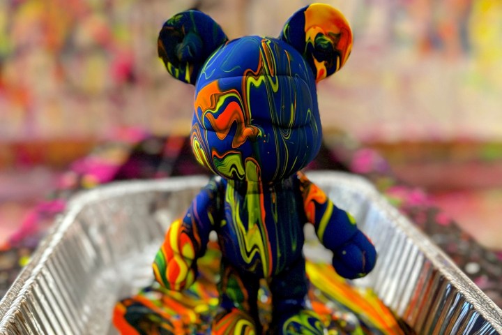 a colorful bird sitting on a table